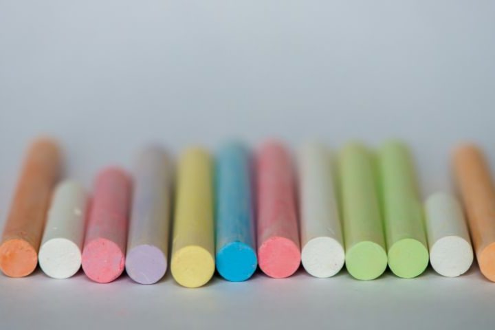 row of coloured chalks lined up neatly