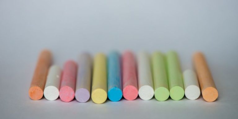 row of coloured chalks lined up neatly