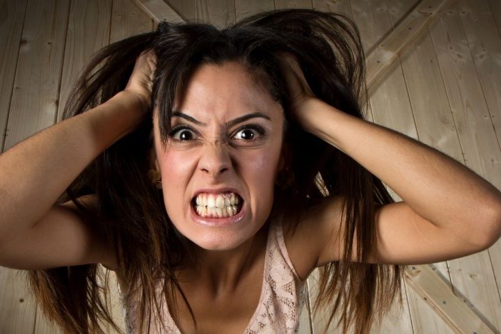 angry women pulling at her hair