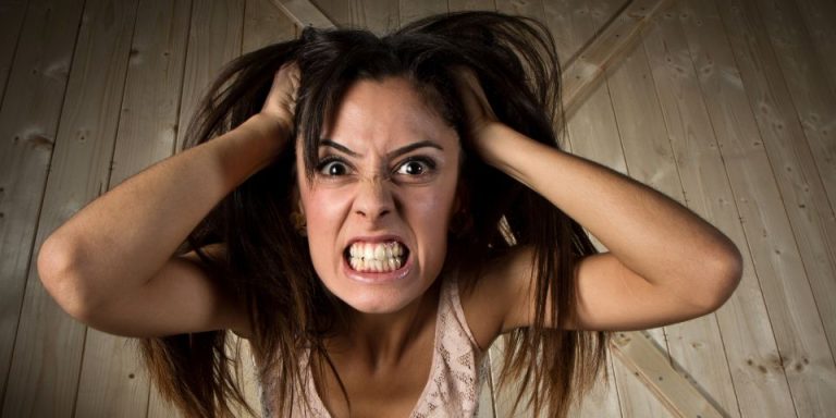angry women pulling at her hair