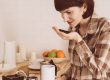 lady smelling coffee beans in her hand